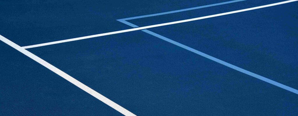 Custom designed pickleball court featuring custom striping and custom court surface colors.