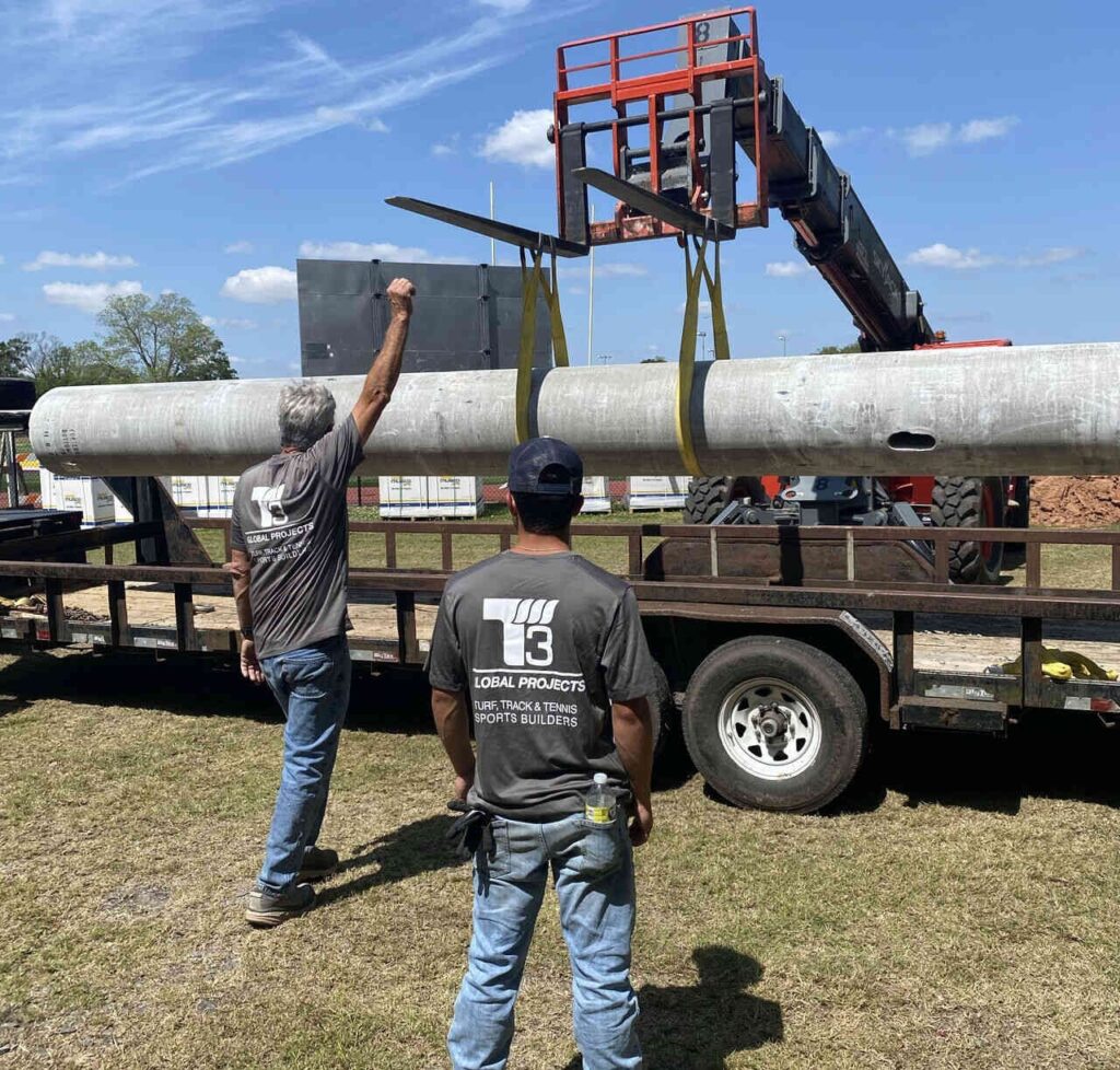T3 Global Projects crew installs Musco lighting for sports construction project.