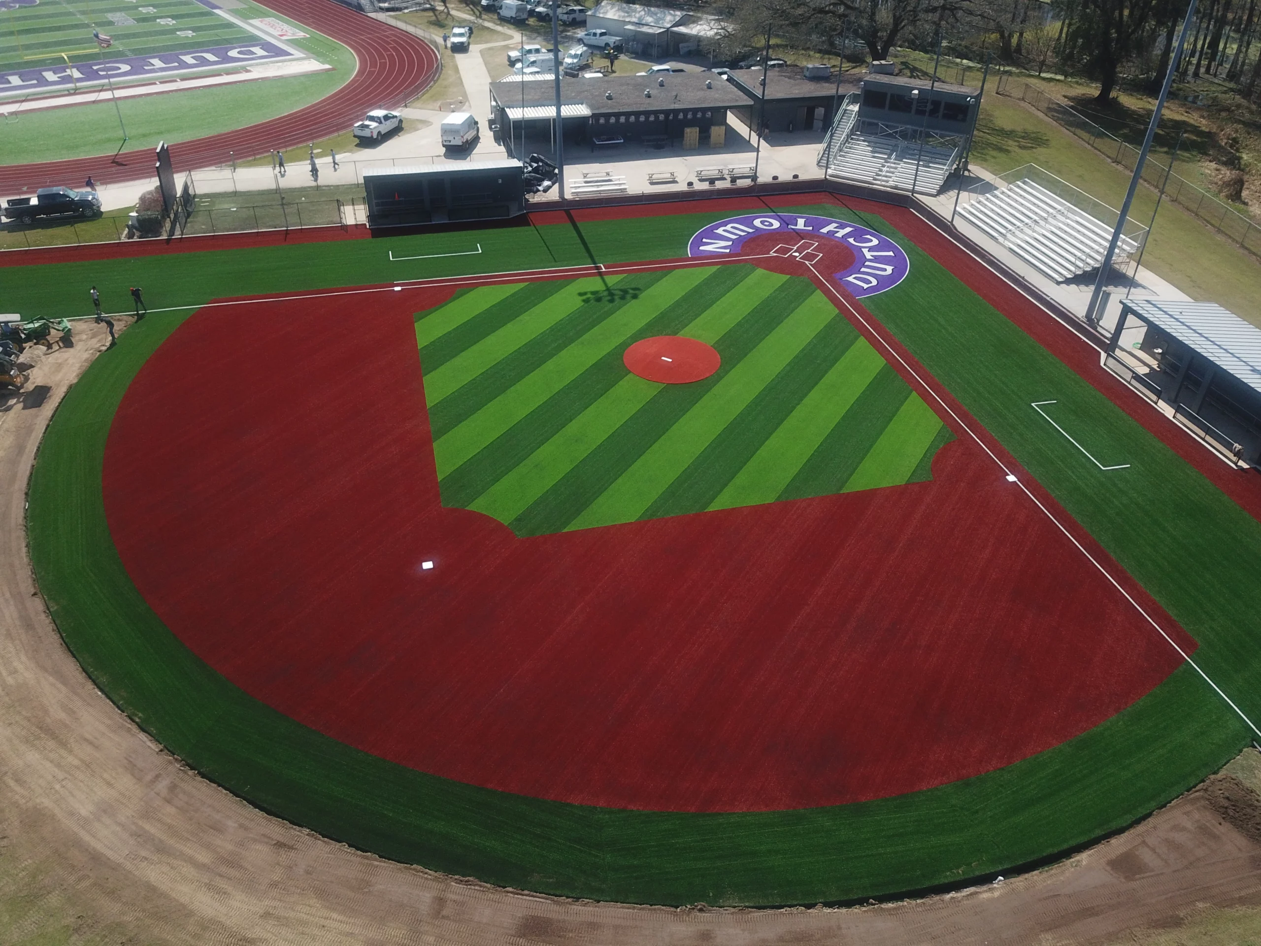 Freshly installed artificial turf baseball field by T3 Global Projects, showcasing a pristine, flat surface designed for true ball roll and a natural grass appearance.